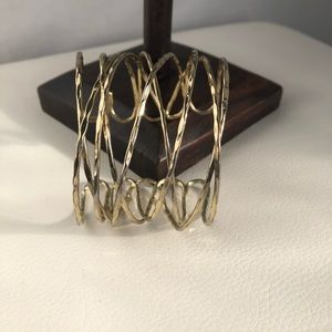 Gold toned criss-cross cuff bracelet
